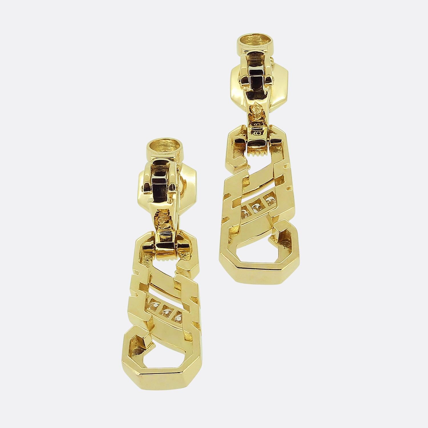 Here we have a stunning pair of diamond drop earrings from the world renowned luxury jewellery house of Cartier. Expertly crafted from 18ct yellow gold, each earring showcases a captivating design with a series of brilliant-cut diamonds, set in a