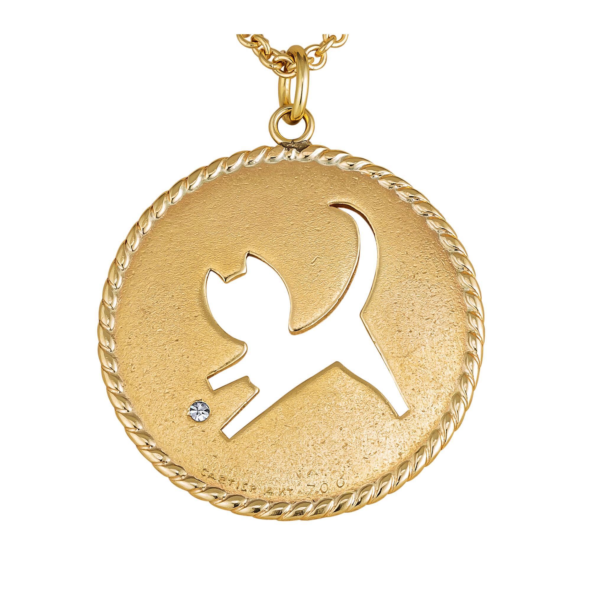 Cartier's 'purrrrr-fect' vintage diamond gold necklace is truly the cat's meow.  With a whimsical cut out cat toying with a sparkling round diamond, this 1 1/2