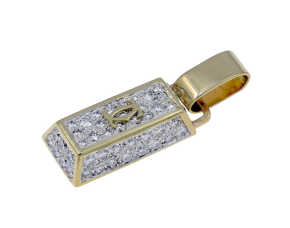 Dazzling 18K yellow gold and platinum charm.  Made and signed by CARTIER.  Encrusted with approximately 2.25 cts. of brilliant white diamonds  CC logo in the center.  1/3