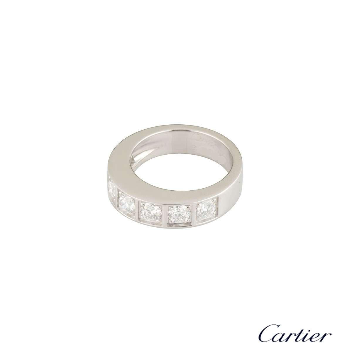 A beautiful 18k white gold half diamond set eternity ring by Cartier. The ring is comprised of 7 round brilliant cut claw set diamonds, each in an individual square surround. The diamonds have a total carat weight of approximately 1.05ct, and are