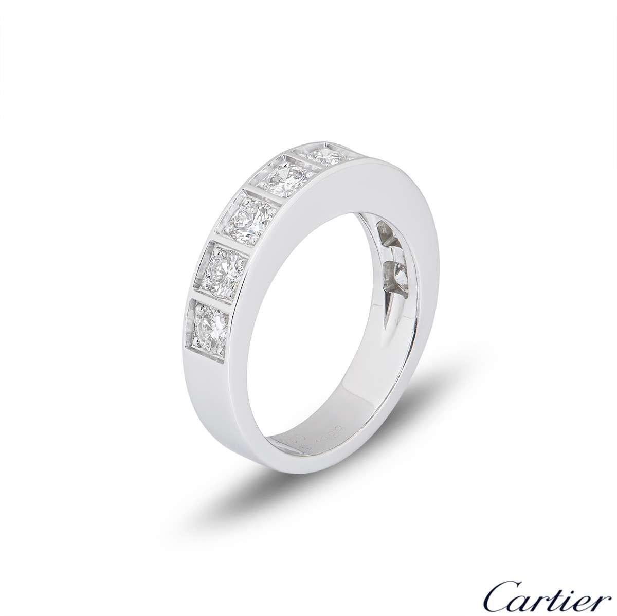 A beautiful 18k white gold half diamond set eternity ring by Cartier. The ring is comprised of 9 round brilliant cut claw set diamonds, each in an individual square surround. The diamonds have a total carat weight of approximately 1.35ct, and are