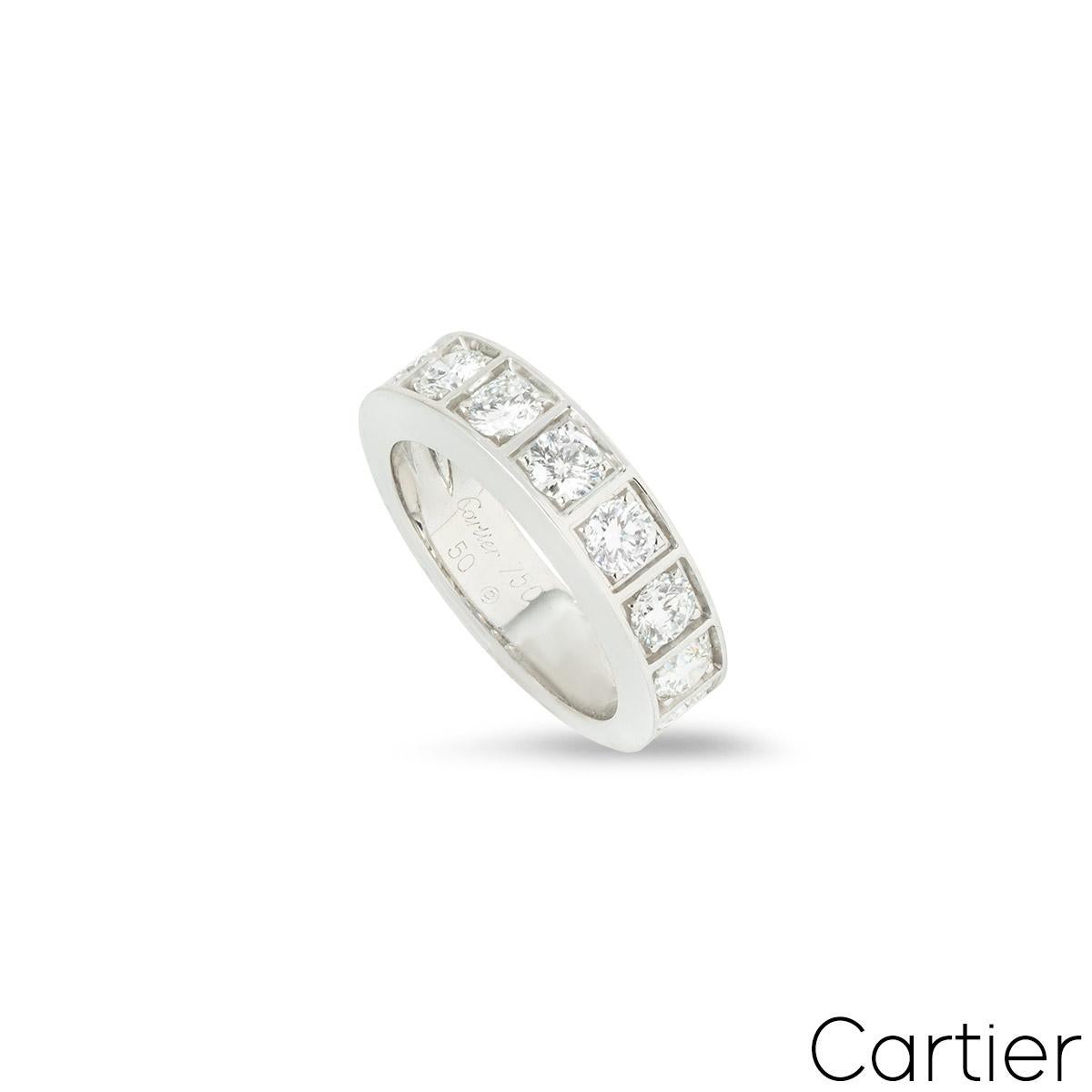 A beautiful 18k white gold half diamond set eternity ring by Cartier. The ring is comprised of 9 round brilliant cut claw set diamonds, each in an individual square surround. The diamonds have a total carat weight of approximately 1.35ct, and are