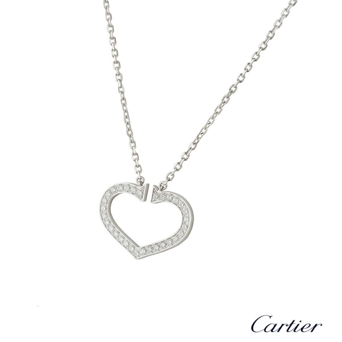 A sparkly 18k white gold Cartier diamond necklace from the Hearts and Symbols collection. The necklace comprises of the iconic heart symbol with 31 round brilliant cut diamonds in a pave setting. The diamonds have a total weight of approximately