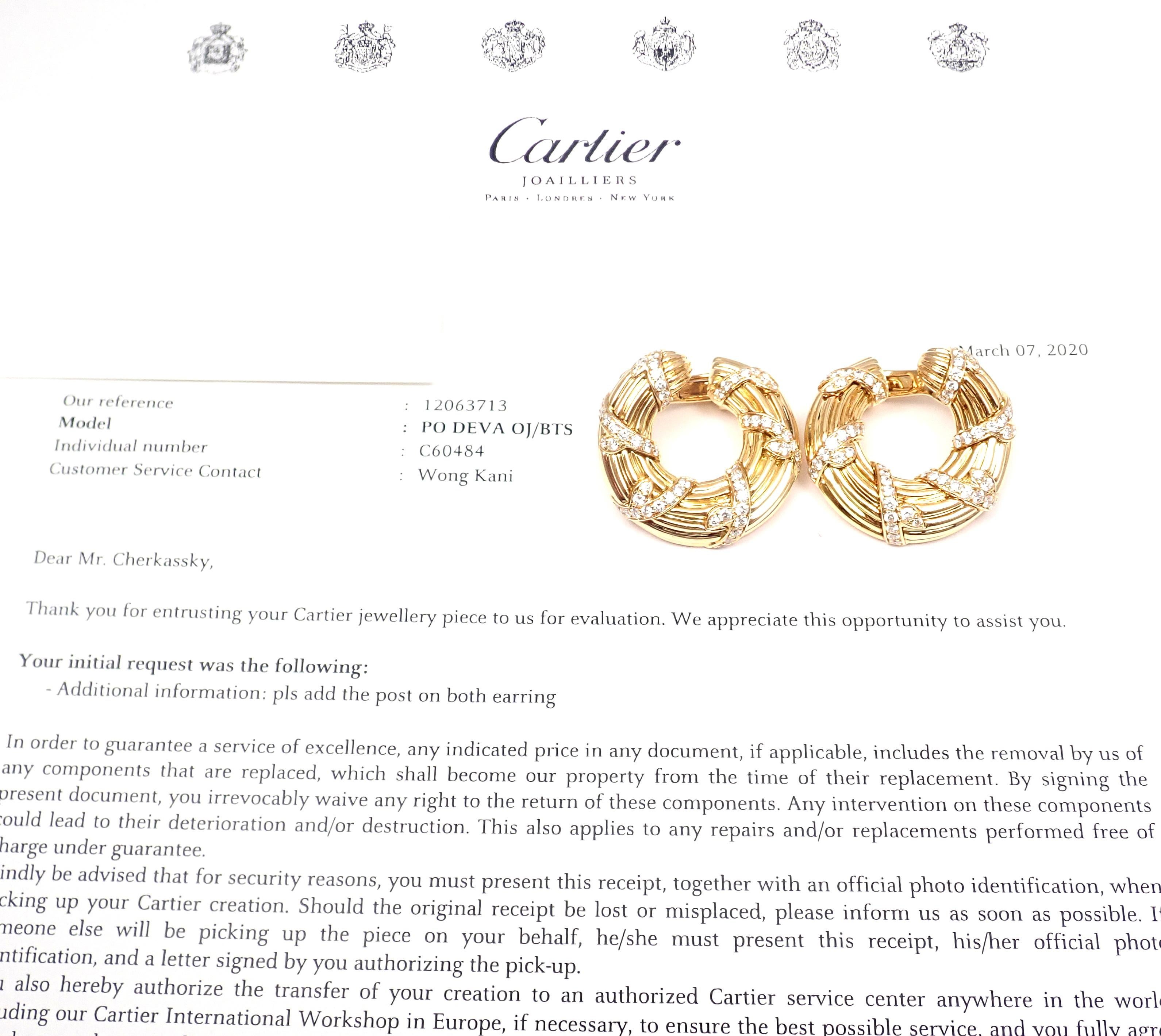 18k Yellow Gold Diamond Hoop Earrings by Cartier. 
With 100 round brilliant cut diamonds VVS1 clarity, E color total weight approximately 2.5ct
Earrings are made for pierced ears.
These earrings come with service paper from Cartier store in NYC and
