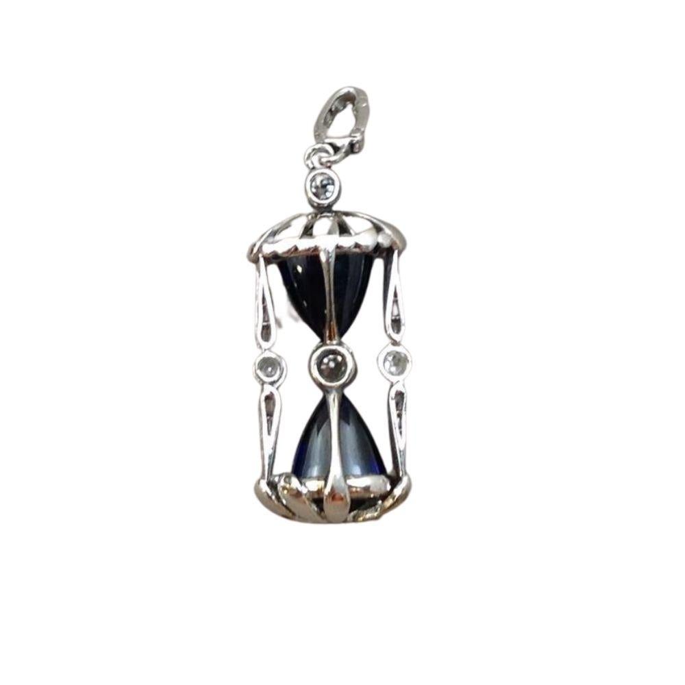 Rare diamond studded hour glass pendant by Cartier.
Made in Platinum.

Dimensions	30mm X 10mm
Marker/Creator	Cartier 
Additional Information 	Comes with original box
Metal	Platinum 
Weight 	6 grams
Signed	Cartier 
