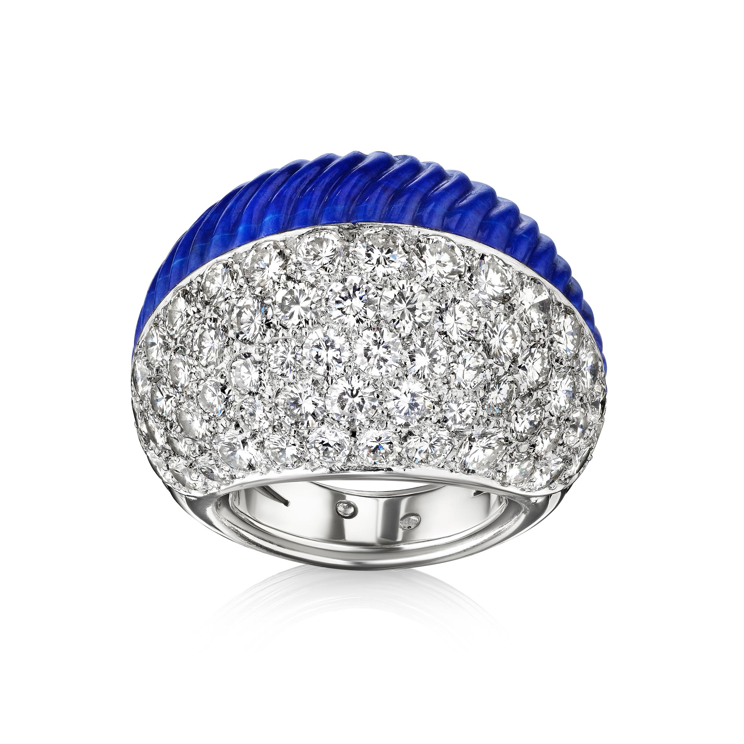 A ring of bombé form composed of half fluted lapis lazuli and half pave-set diamonds; mounted in platinum, with French assay marks
• Diamonds, total weighing approximately 2.5 carats 
• Marks: Cartier Paris 017207
• Measurements: 3/4 x 1 x 1 1/8