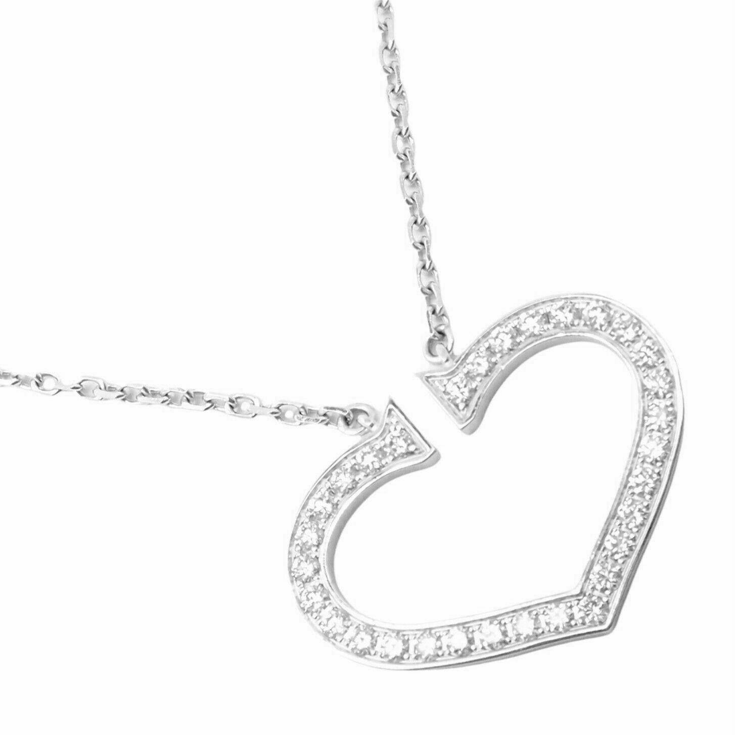 18k White Gold Diamond Large C Heart Pendant Necklace by Cartier. 
With 30 round brilliant cut diamonds VVS1 clarity, E color total weight approx. .60ct
*Includes Cartier Service Certificate
Details: 
Pendant: 20mm x 27mm
Length: 17.25