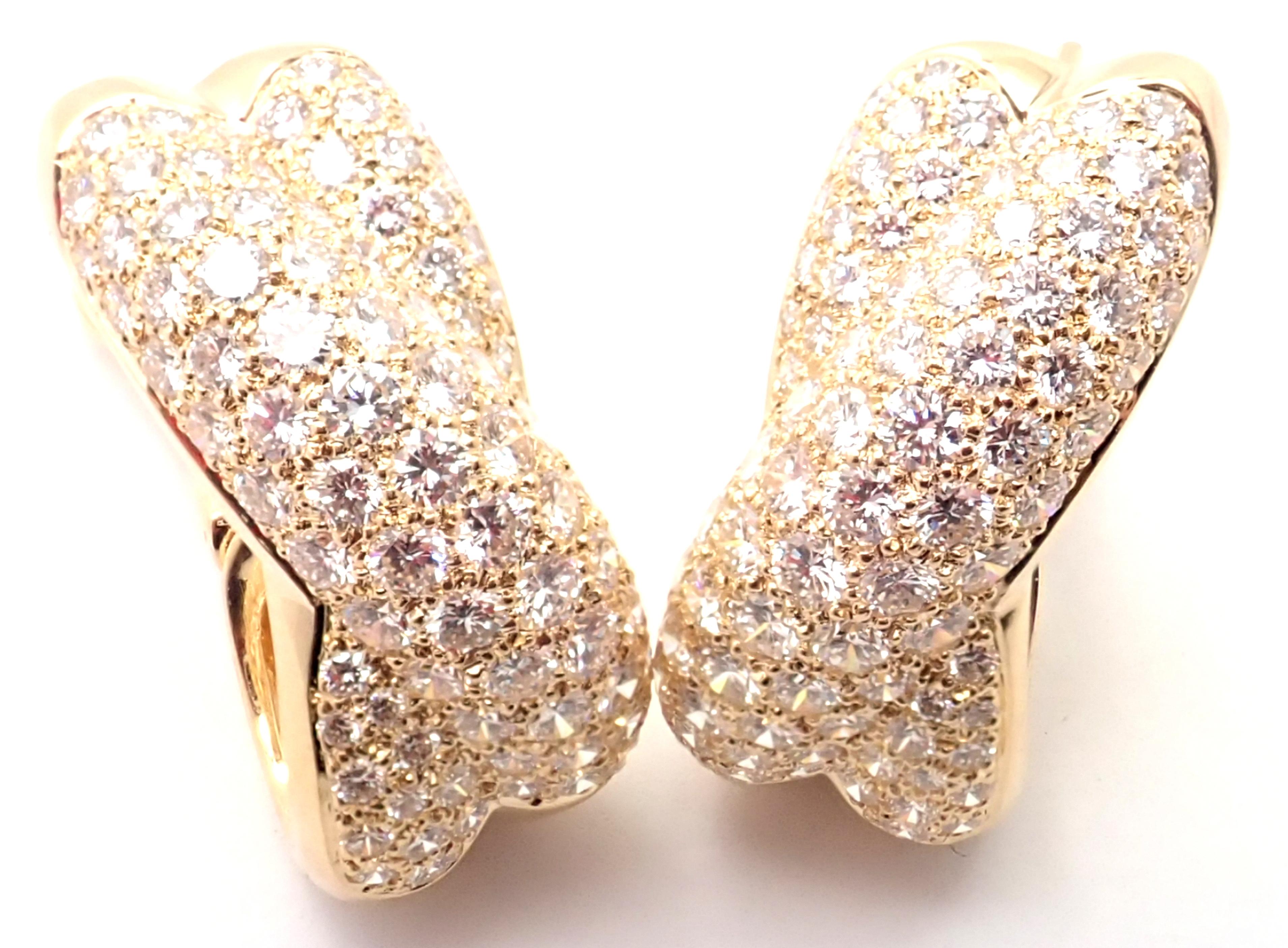 18k Yellow Gold Diamond Crossover Large Earrings by Cartier. 
With Round brilliant cut diamonds total weight approximately 5ct. 
Diamonds VVS1 clarity, E color
***Earrings are made for pierced ears.
Details:
Measurements: 26mm  x 12mm
Weight: 20.5