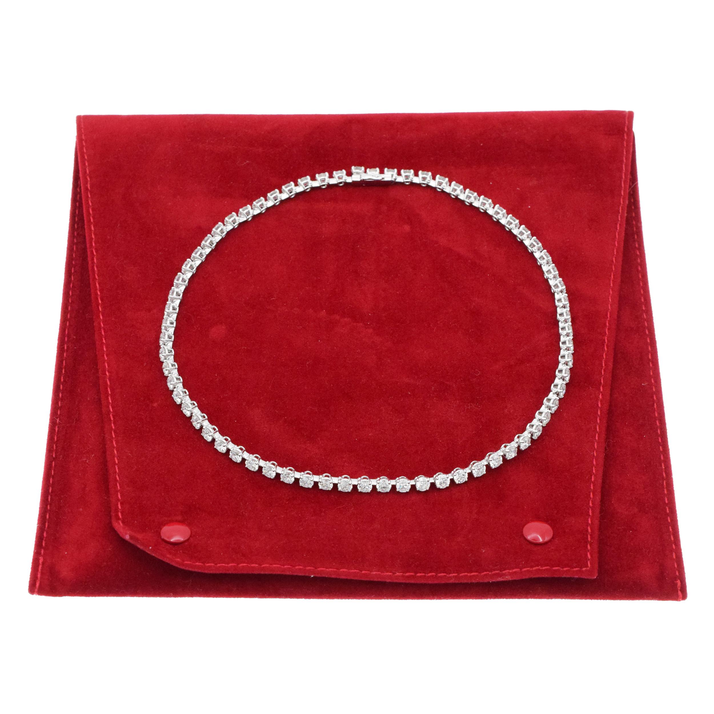 Cartier Diamond line Necklace in Platinum and 18k
White Gold. The necklace consists of 68 round brilliant cut diamonds with total weight of
approximately 22.00ct, color F-G, clarity VS.
Inscribed: Cartier, PT950, XXXX 
.Equipped with box clasp with