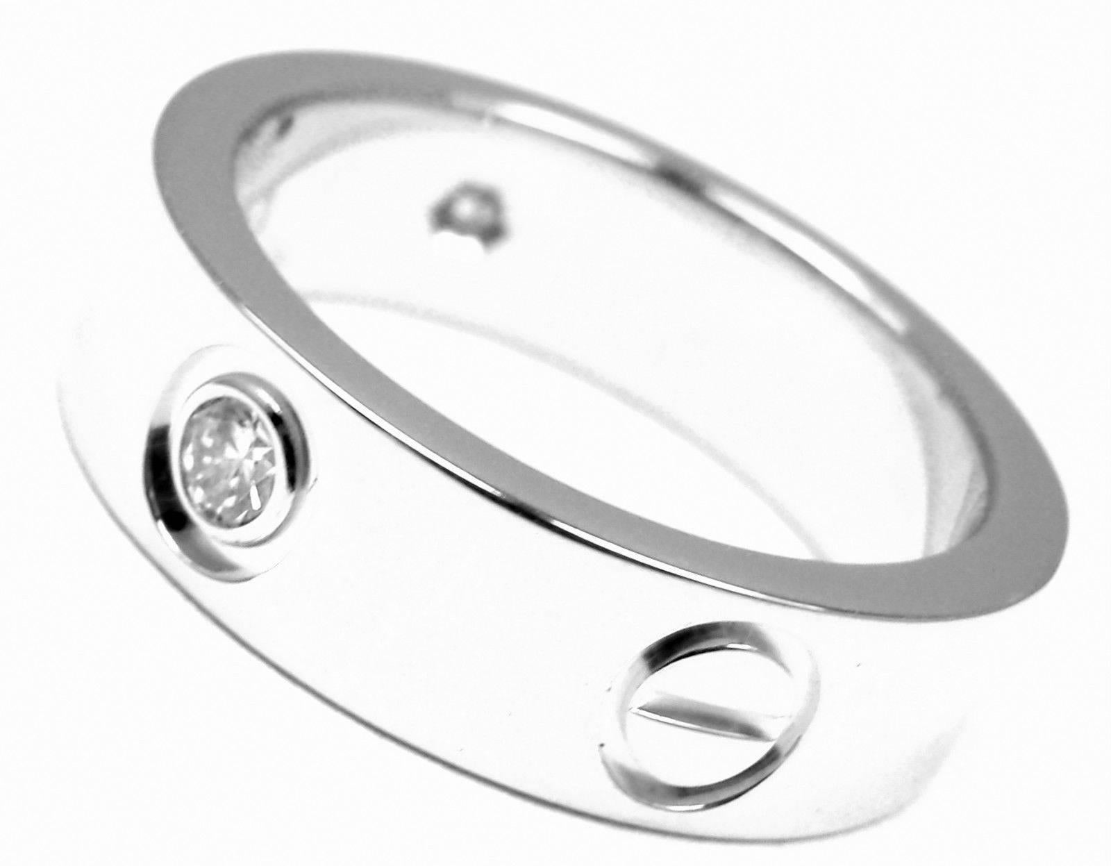 18k White Gold Diamond LOVE Band Ring by Cartier.  
With 3 round brilliant cut diamonds VS1 clarity, E color total weight .22ct
Retail: $3,750
This ring comes with Cartier box.
Details: 
Band Width: 6mm 
Weight:  8.6 grams
Ring Size: European 51, US