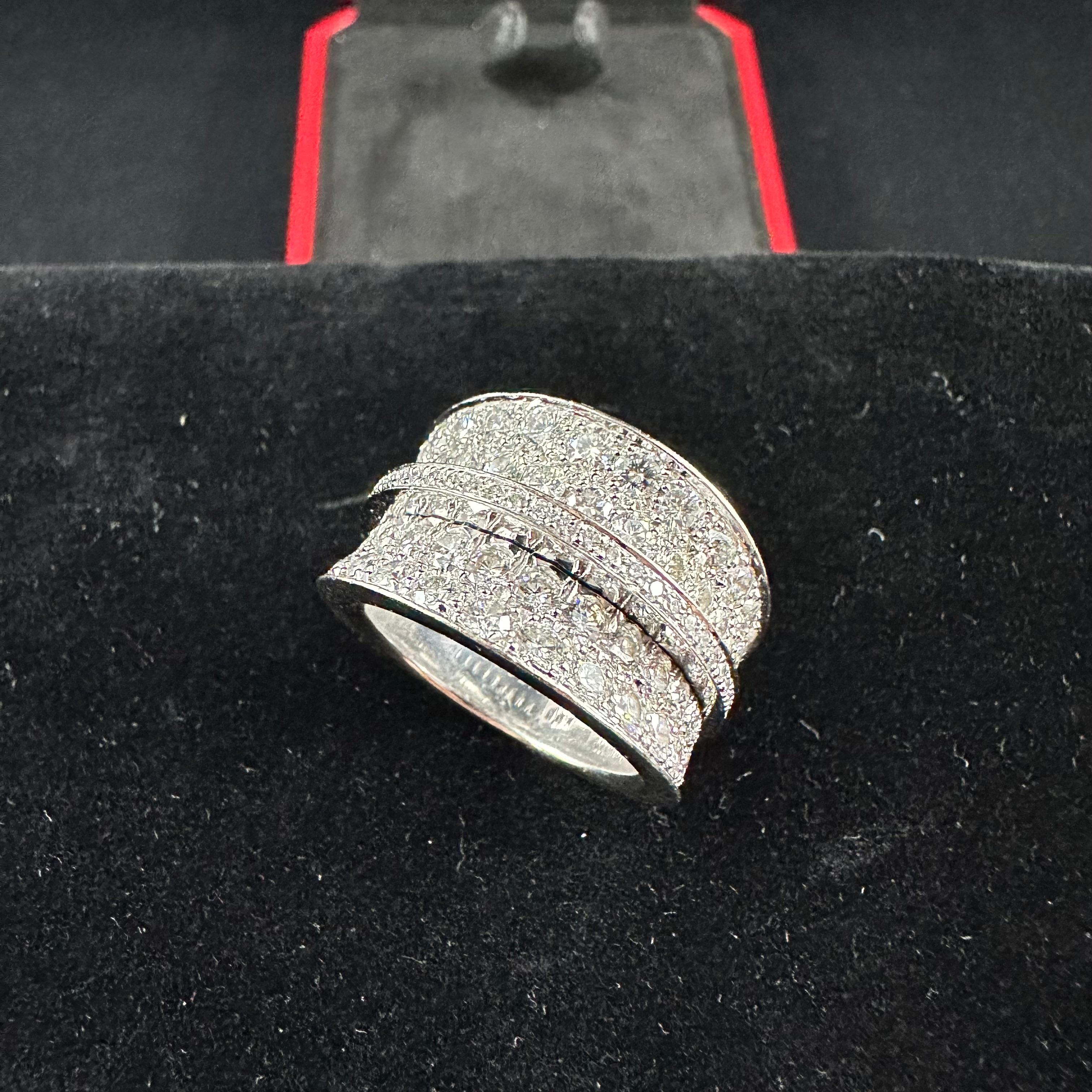 French Cartier Diamond Band 
White Gold 18k
105 Diamonds total Weight 4.00 cts 
14 mm Width 
Size 54 or 6.5 US
Substantial Weight 22g of 18K White Gold Beautiful Pave Set Round Diamond.

Cartier ring, 18K white gold (750/1000), set with 104