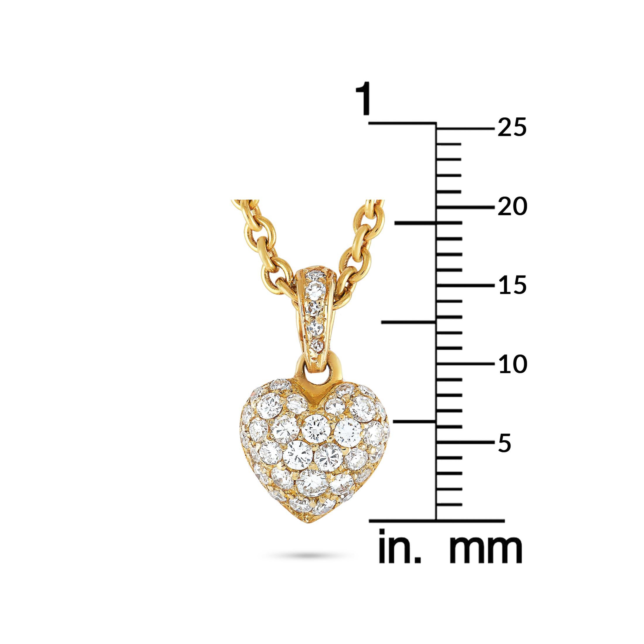 This Cartier necklace is made out of 18K yellow gold and diamonds and weighs 9.6 grams. The diamonds boast grade F color and VVS clarity and amount to approximately 0.85 carats. The necklace is presented with a 16” chain and a heart pendant that