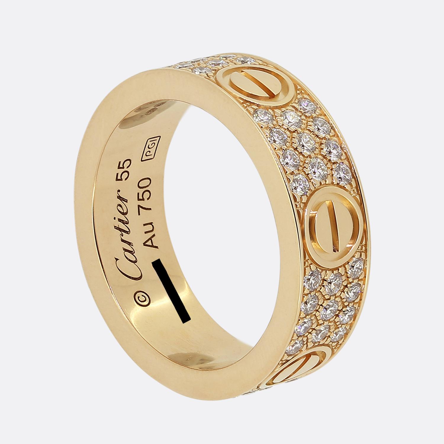 Here we have an 18ct rose gold band ring from the world renowned luxury jewellery house of Cartier. This ring forms part of their LOVE collection and showcases a consistent alternating design around the entire band featuring three diamond set rows