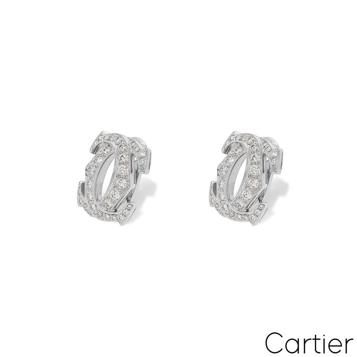 A stunning pair of 18k white gold diamond earrings by Cartier from the Penelope collection. Each of the earrings comprise of the iconic double c motif pave set with 34 round brilliant cut diamonds. The 68 diamonds have an approximate total weight of