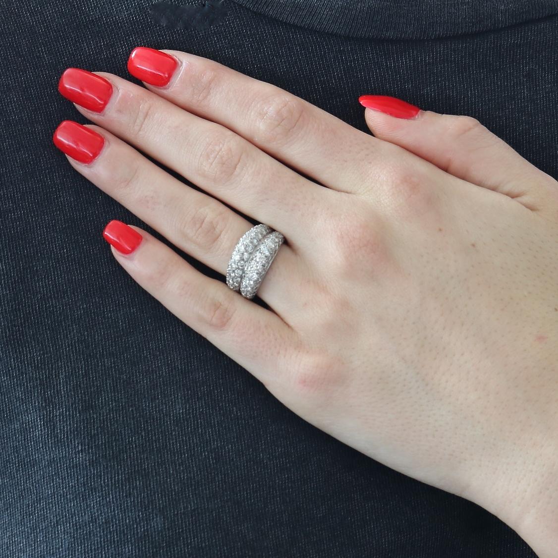 Dazzling 1960's Cartier diamond platinum and 18k gold Ring. Featuring 60 round brilliant cut diamonds that weigh approximately 2.50 carats, E-F in color, VS+ clarity. Signed Cartier and stamped with French eagle head and dog head hallmarks. Ring