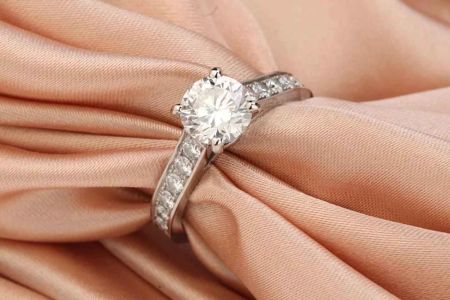 This stunning pre-owned Cartier Solitaire ring has been beautifully crafted from platinum, set with a dazzling brilliant cut 1.23-carat diamond, which has been GIA certificated (2317785223) The beautiful convex shoulders are paved with brilliant-cut