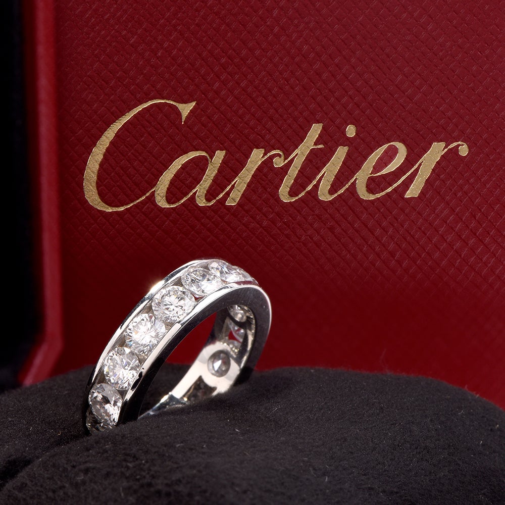 This classic Cartier eternity band is crafted in solid platinum, chanell set with 16 high qualityround-cut diamonds of approx. 4.25 carats, E-F color VVS1 clarity.

Signed and Numbered and comes with its original Box.

Ring Size:6

Total Diamonds: