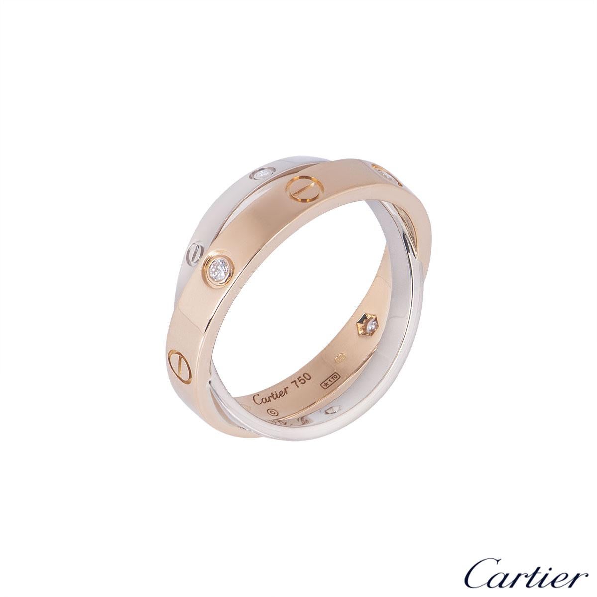 An 18k bi-colour gold double ring by Cartier from the Love collection. The white and rose gold ring is set with the iconic screw motif, alternating with diamonds. The 6 round brilliant cut diamonds have a weight of 0.07ct. The ring is a size UK N,