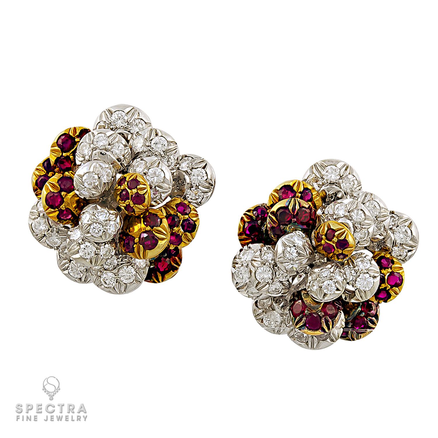 Beautiful ear clips made by Cartier in 1980s. 
Designed as clusters of balls set with diamonds and rubies arranged in multi layers. 
Metal is 18k white & yellow gold, 26.78 grams.
Signed Cartier Italy.
Clip-on style.