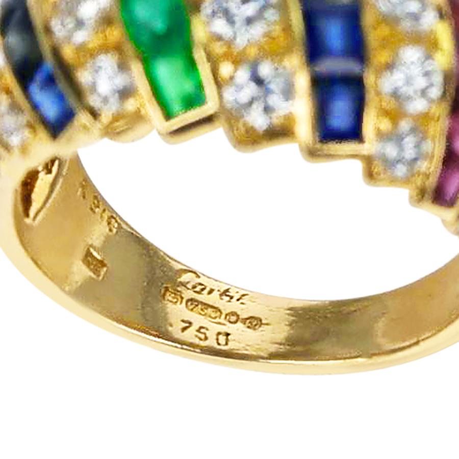 A Cartier Diamond, Ruby, Emerald, Sapphire Bombe Ring from the 1980s. The diamonds weigh appx. 1.60 carats total. The mark JC is for Jacques Cartier. Ring size US 6. 

SKU: 1204-GJRARJM