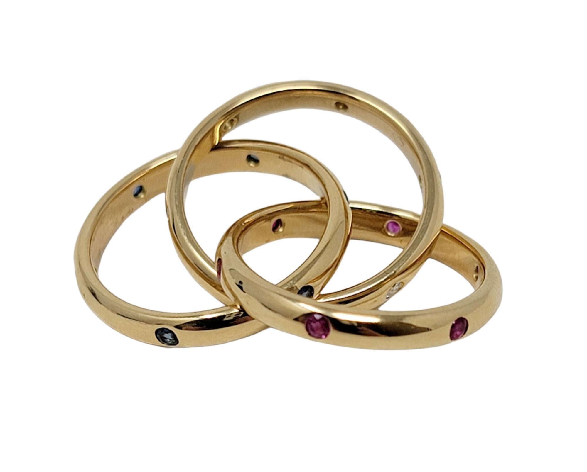 Contemporary Cartier Diamond, Sapphire and Ruby Trinity Band Ring in 18 Karat Yellow Gold 48