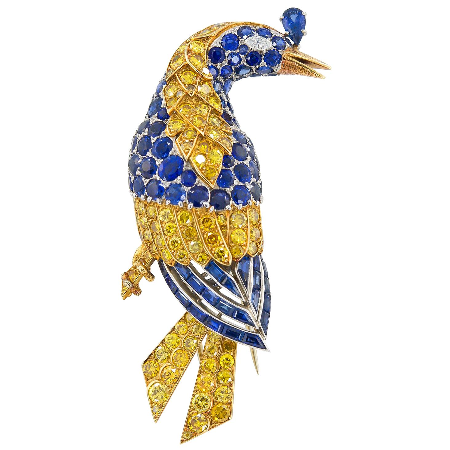 Cartier Broche oiseau en or jaune et platine avec diamants et saphirs en vente