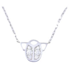 Cartier, collier scarabée en or blanc 18 carats et diamants