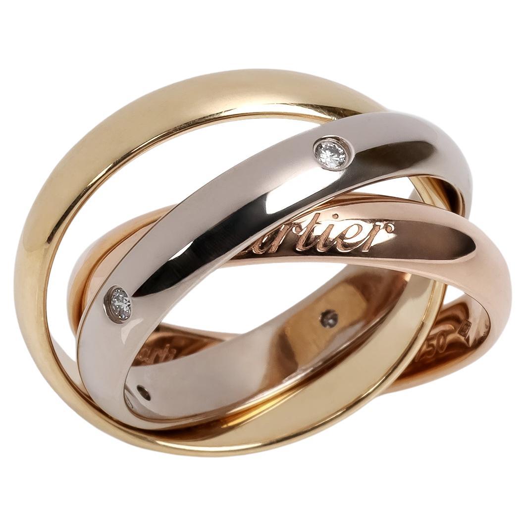 Bague Trinity de Cartier en or blanc, jaune et rose 18 carats sertie de diamants en vente