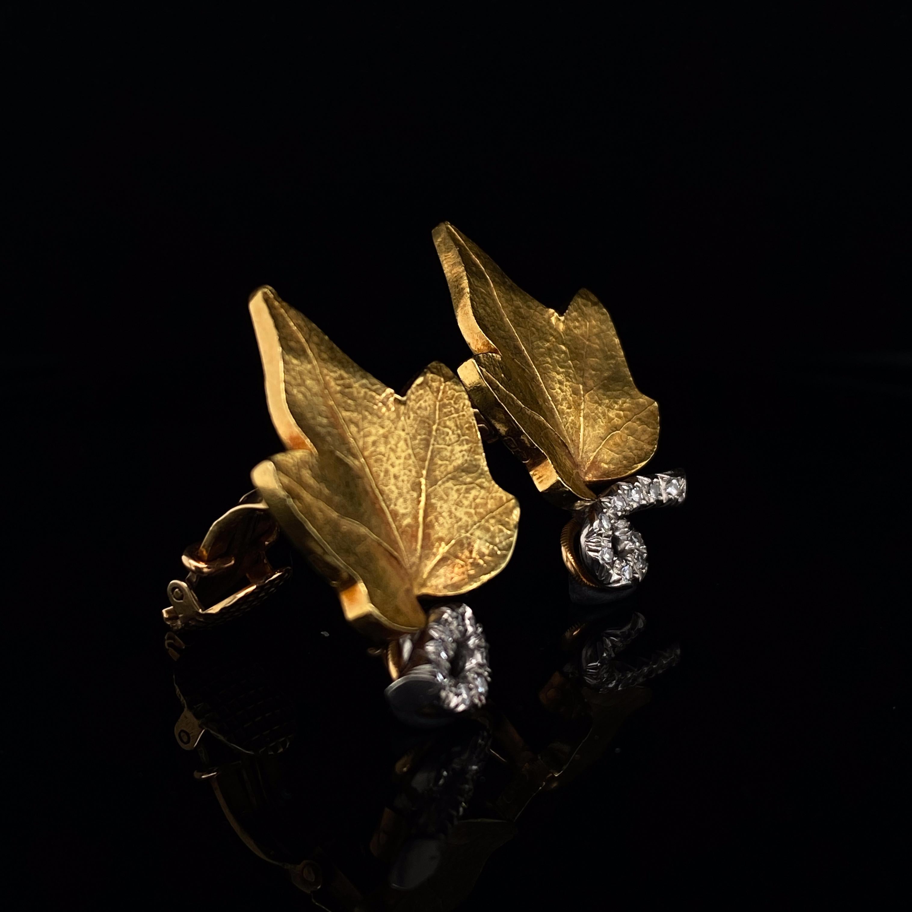 A wonderfully rare pair of Cartier Diamond Set Yellow Gold Retro Leaf Design Earrings circa 1950.

The leaves are worked in 14 Karat yellow gold and are exquisitely detailed with delicate veining against a softly bloomed matte finish. The stems are