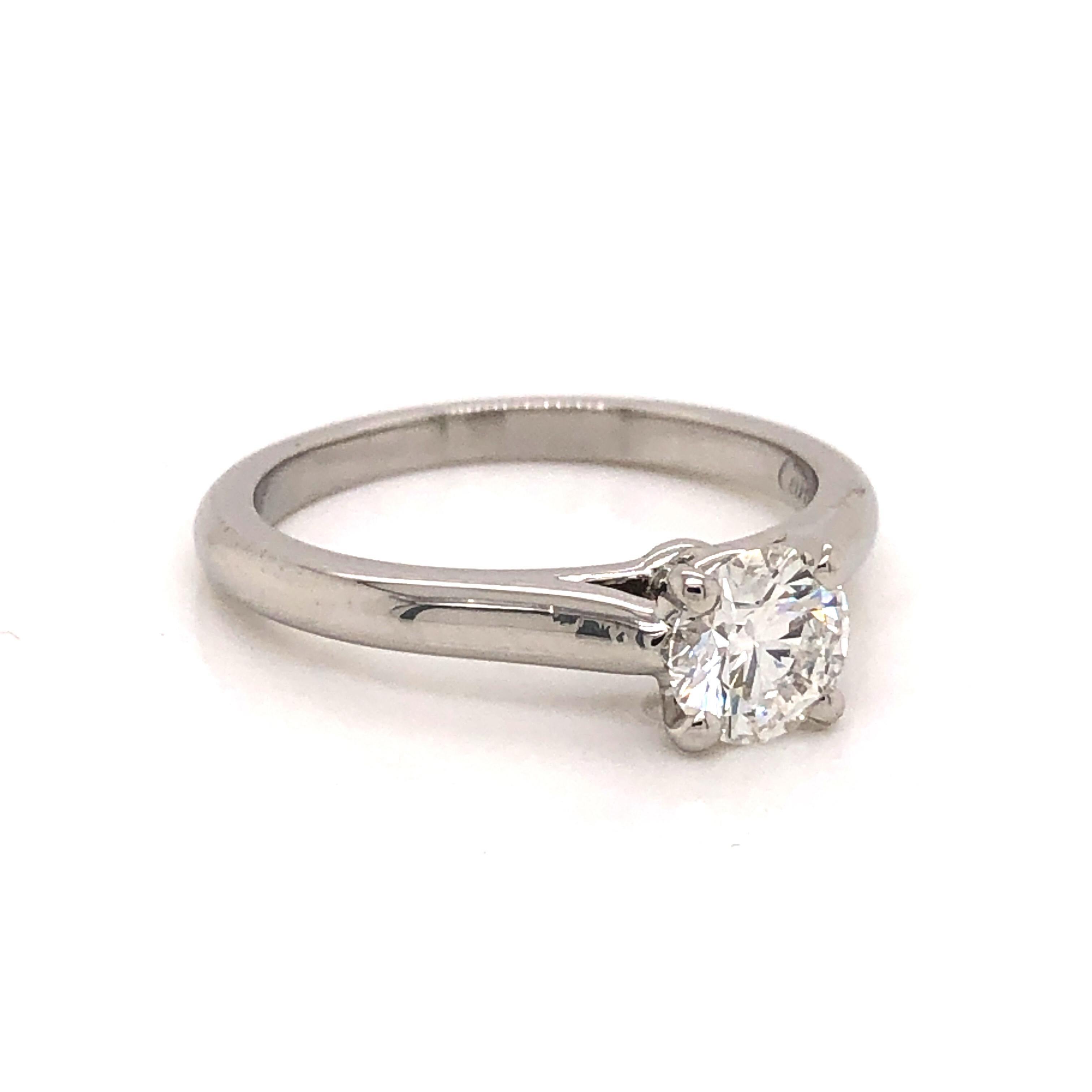 Amazing timeless design by famed jewelry designer Cartier. This ring is crafted in platinum and fully hallmarked by the designer. On the interior of the ring 