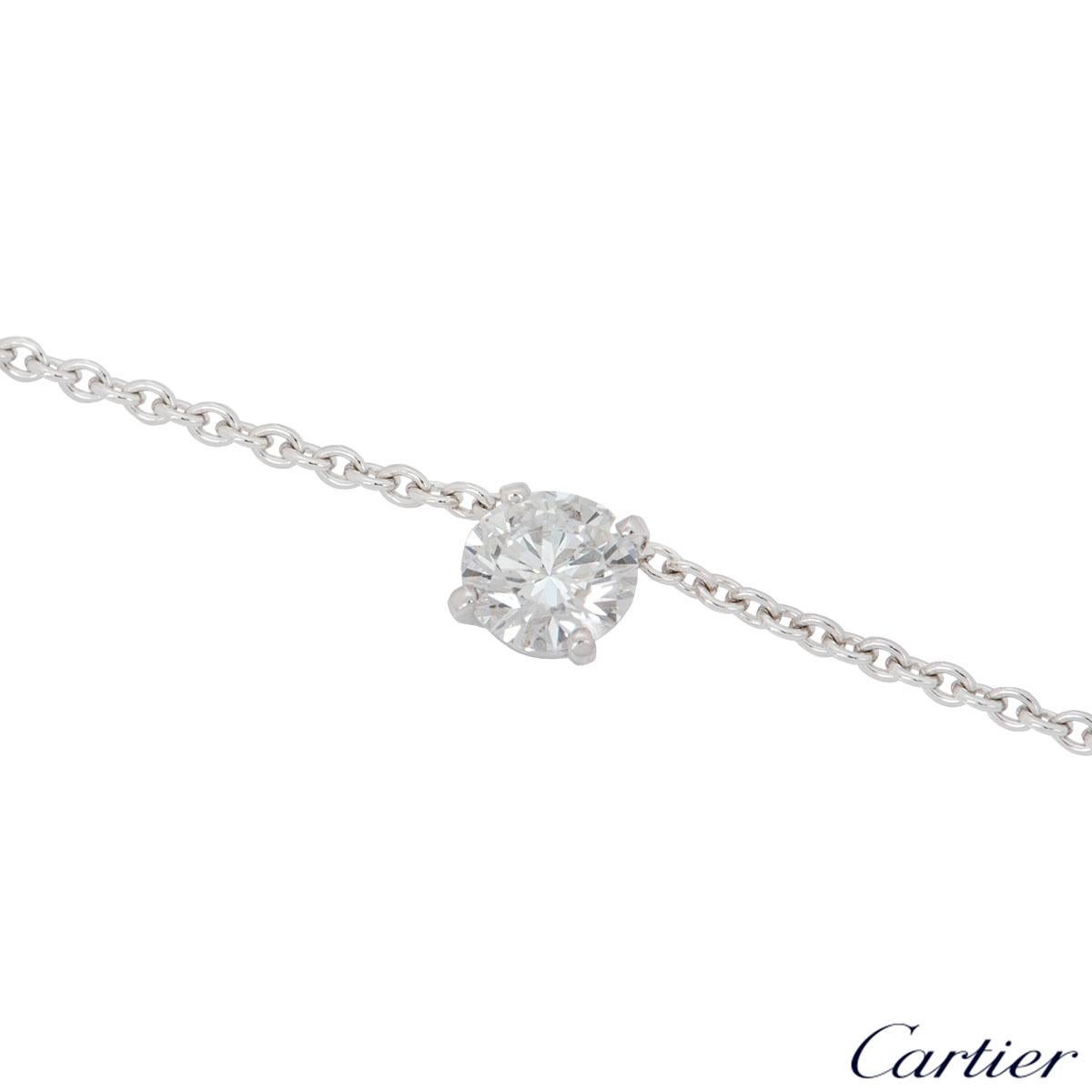 A beautiful 18k white gold diamond necklace by Cartier. The necklace is set to the centre with a 0.80ct round brilliant cut diamond, E colour and VS2 in clarity. The necklace has a length of 16 inches and features a fishhook clasp with a gross