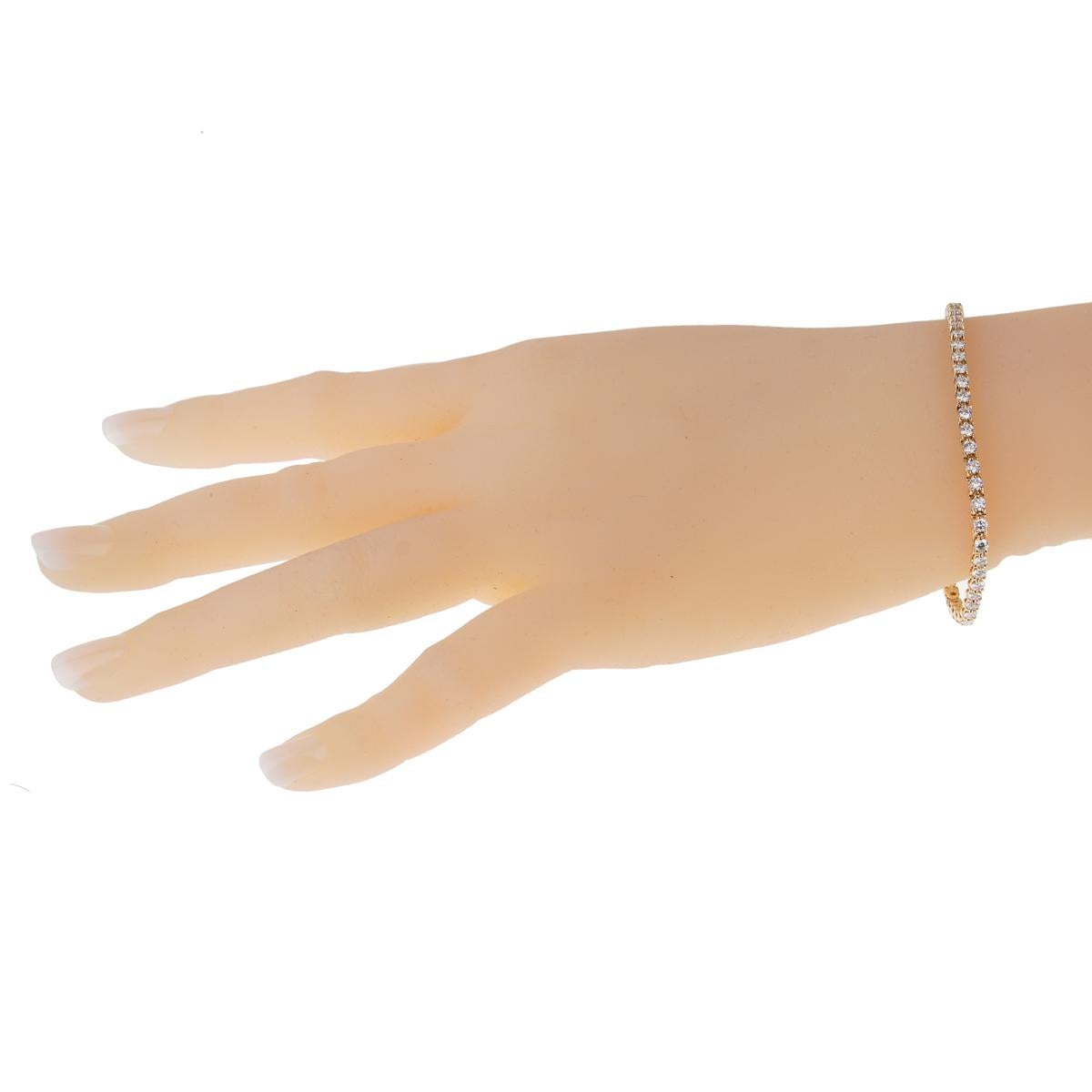 The Cartier diamond gold tennis bracelet is without a doubt a modern classic for any woman's wardrobe! Set in 18k yellow gold with the finest of Cartier round brilliant cut diamonds and weighing a total of approximately 3 carats, this Cartier