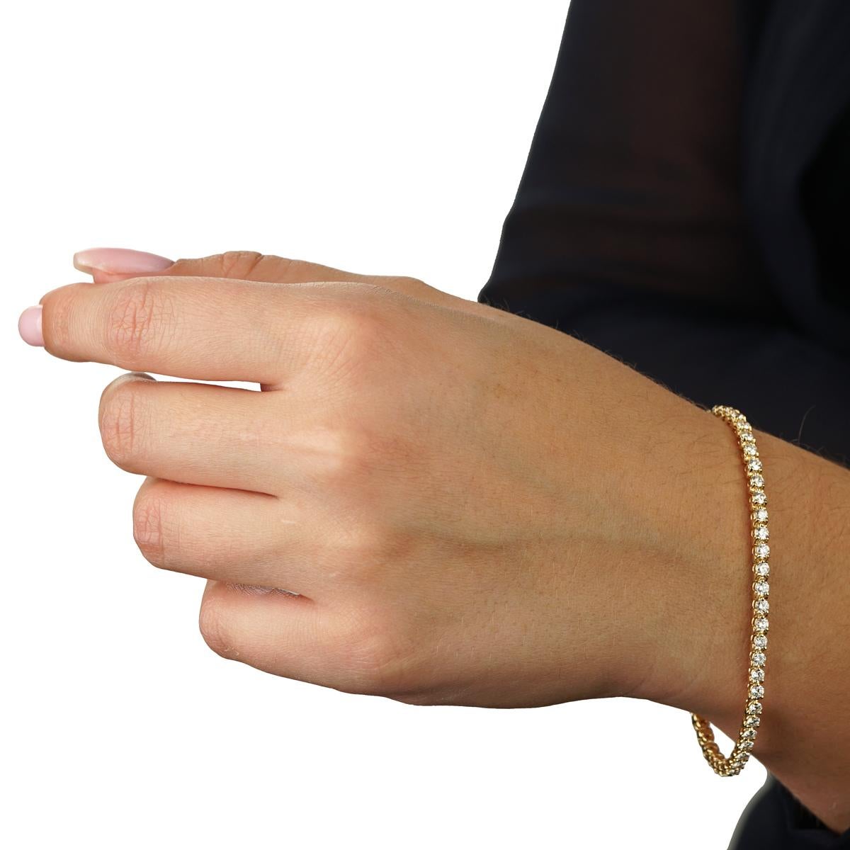 The Cartier diamond gold tennis bracelet is without a doubt a modern classic for any woman's wardrobe! Set in 18k yellow gold with the finest of Cartier round brilliant cut diamonds and weighing a total of approximately 3 carats, this Cartier
