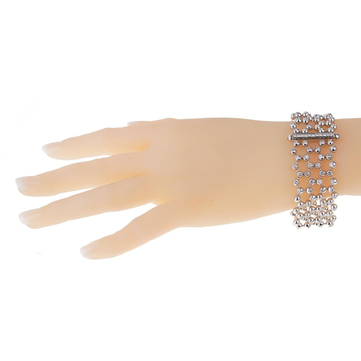 This Cartier diamond gold tennis bracelet is a perfect example of craftsmanship meeting flawless design. 8.2 carats of the finest Cartier round brilliant cut diamonds are embedded throughout this Cartier multi strand diamond gold tennis bracelet,