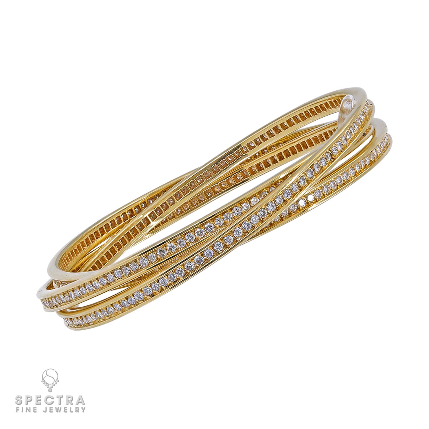 A triple-bangle made by Cartier from the 'Trinity' collection, comprising of 7.62 carats of diamonds, set in 18k yellow gold.
Gross weight 62.10 g.
Stamped Cartier Paris with a serial number.
Circa 2005.
Width 0.01 inch (0.3mm).
Inner circumference