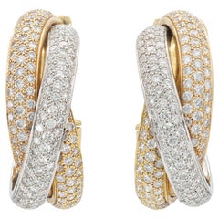 Orecchini Trinity con diamanti di Cartier
