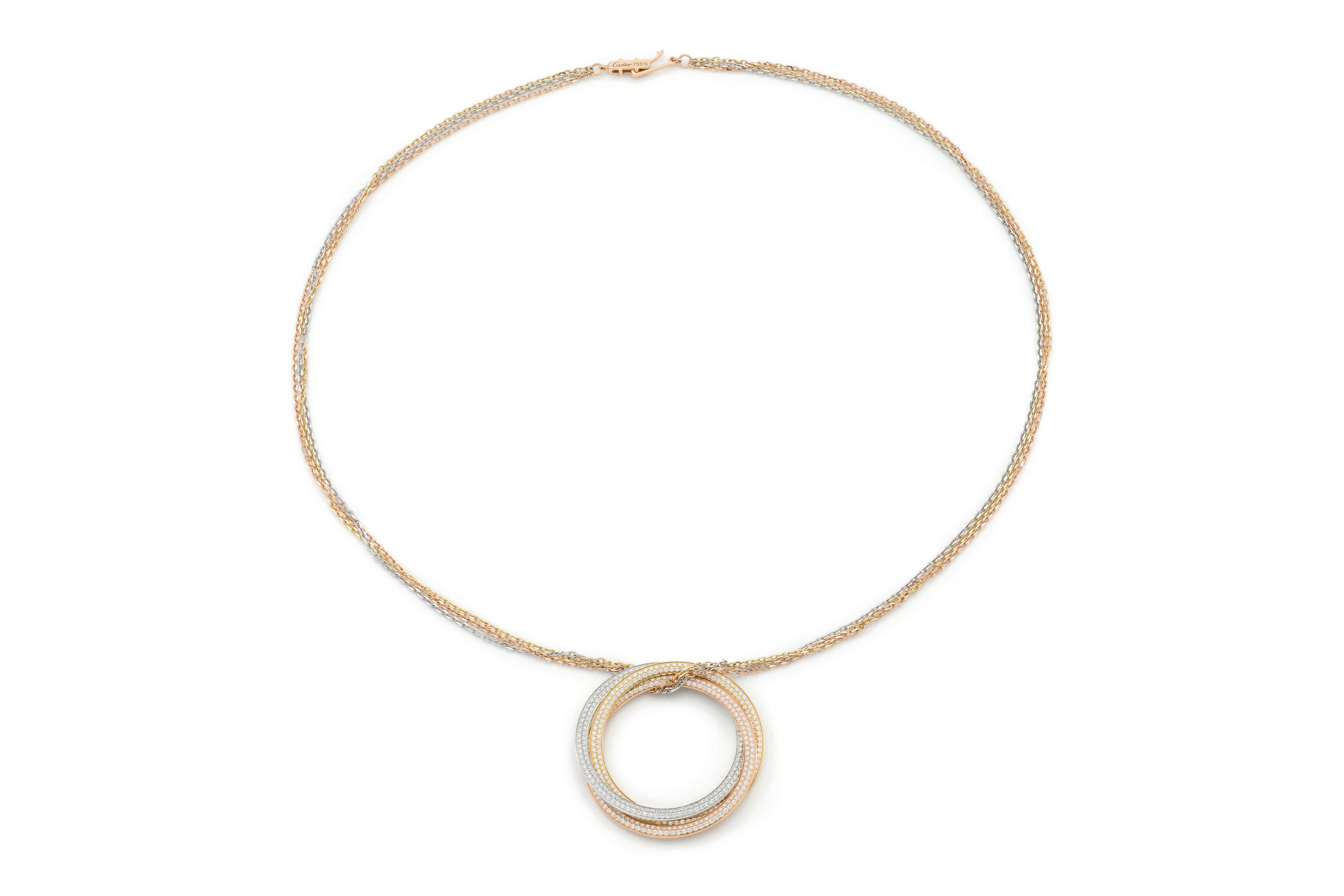 Finely crafted in 18 rose, yellow, and white gold with pave-set Round Brilliant cut Diamonds weighing approximately a total of 2.60 carats.
Signed by Cartier, from their Trinity collection.
1 3/4 inch diameter, 22 inch long chain