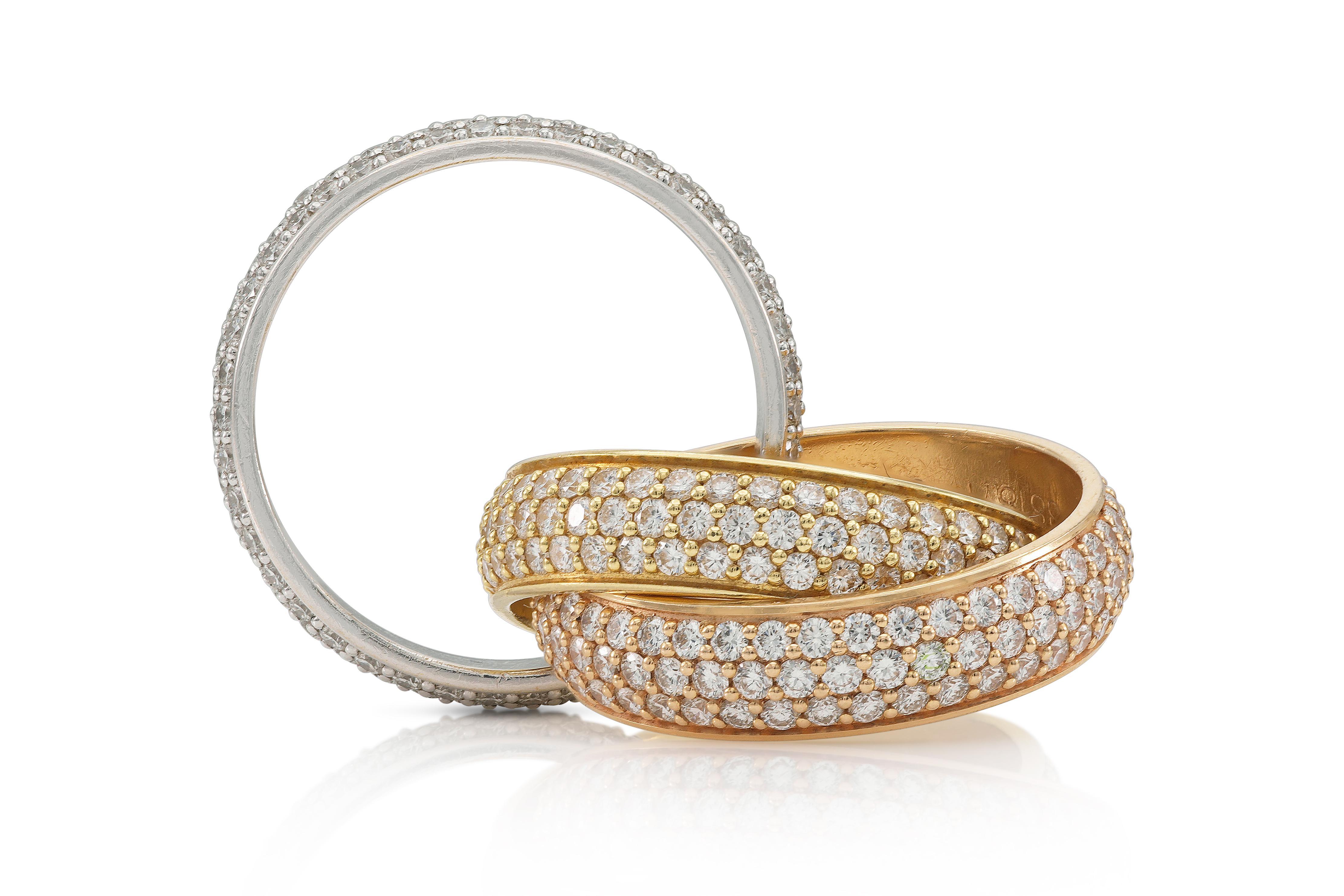 Finely crafted in 18k rose, yellow, and white gold with pave-set Round Brilliant cut Diamonds weighing a total of approximately 3.20 carats.
Signed by Cartier, from their Trinity collection.
Large model, each band measures 5.4 mm
Size 51 (US 5