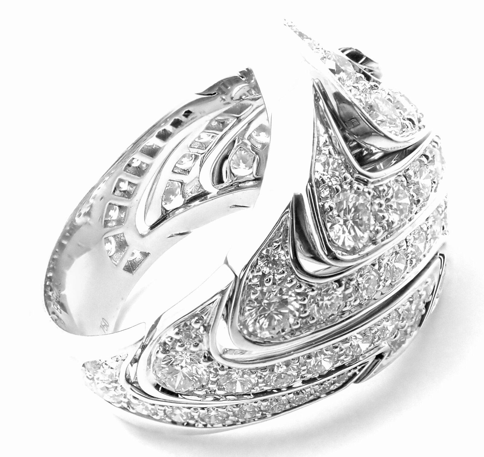 18k White Gold Diamond Diamond Large Ring by Cartier.  
This ring comes with a Cartier box.
With 86 Round brilliant cut diamonds VVS1 clarity, E color total weight approximately 4.30ct
Details: 
Ring Size: European 58, US 8 1/4
Weight:  26.2