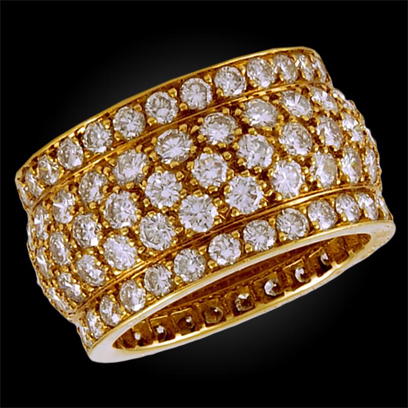 An exceptional Nigeria wedding band by Cartier, crafted in 18k yellow gold, pavé set throughout with round brilliant cut diamonds. Signed Cartier 

Size 54