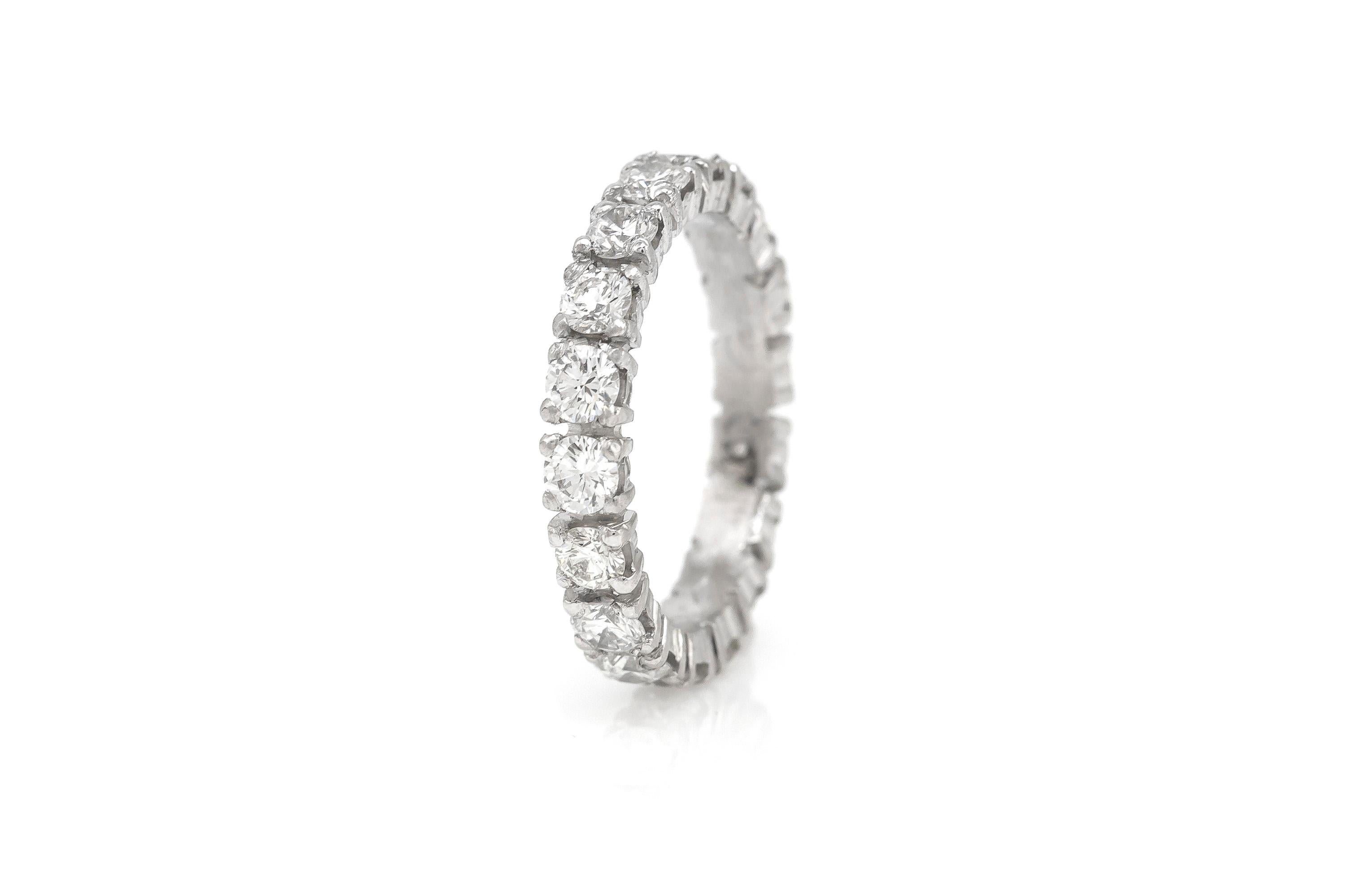 Finely crafted in platinum with 18 round brilliant cut diamonds, weighing a total of approximately 1.80 carats.
Signed by Cartier.
Size 5 3/4