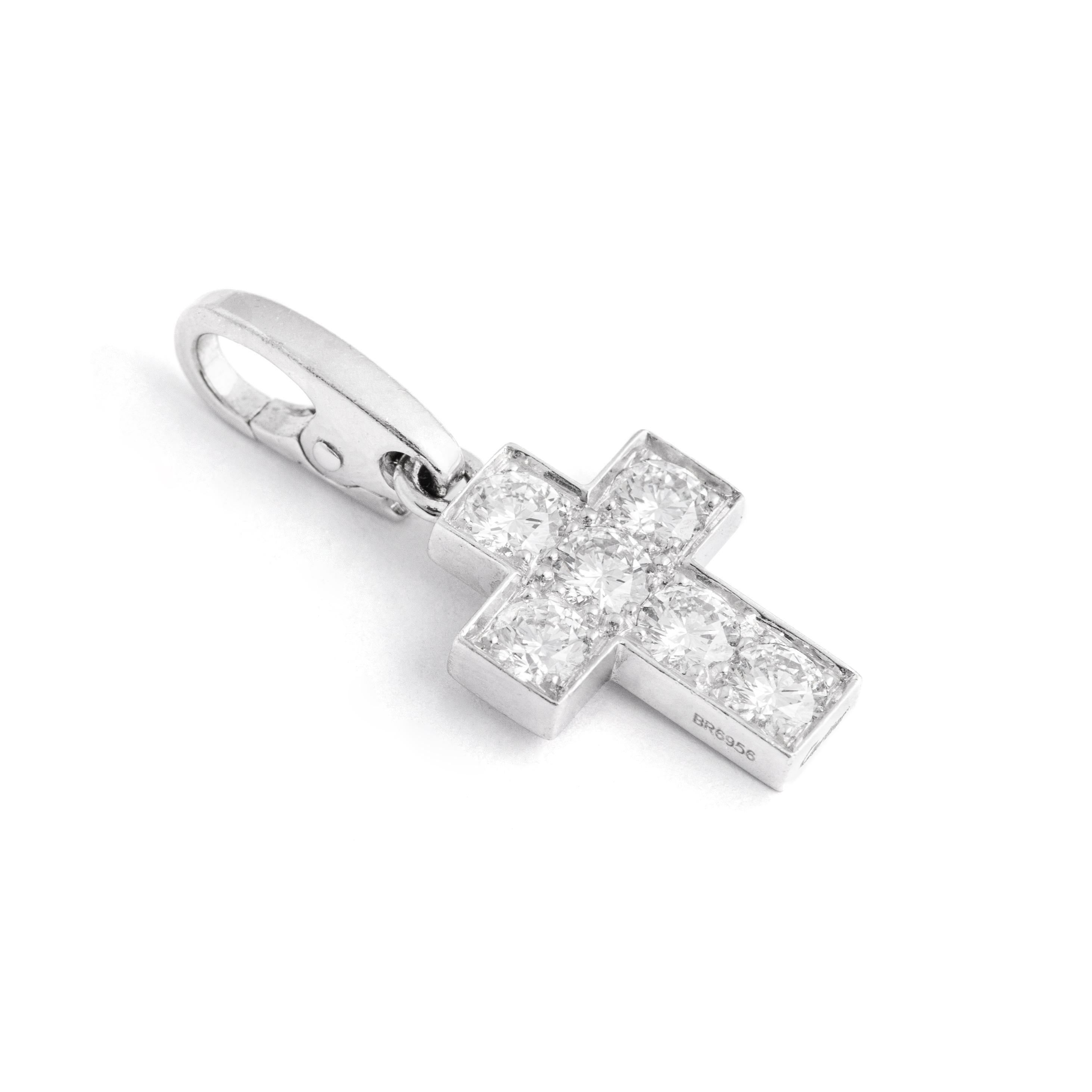 Cartier Diamond on White Gold 18K Cross Pendant Charm.
A stylish 18k white gold Cartier diamond pendant charm representing a Cross. The pendant is set with round brilliant cut diamonds, G color and VS clarity. 

Signed Cartier, numbered and