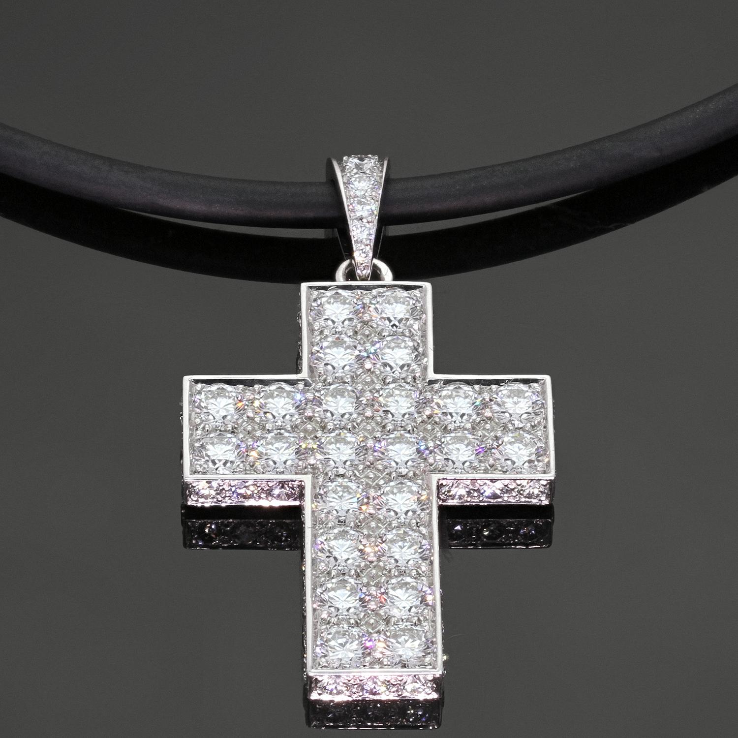 This stunning Cartier pendant is designed as a Latin cross crafted in 18k white gold and set with approximately 70 brilliant-cut round diamonds weighing an estimated 6.50 carats. The pendant features a diamond pave on the front and the sides and the