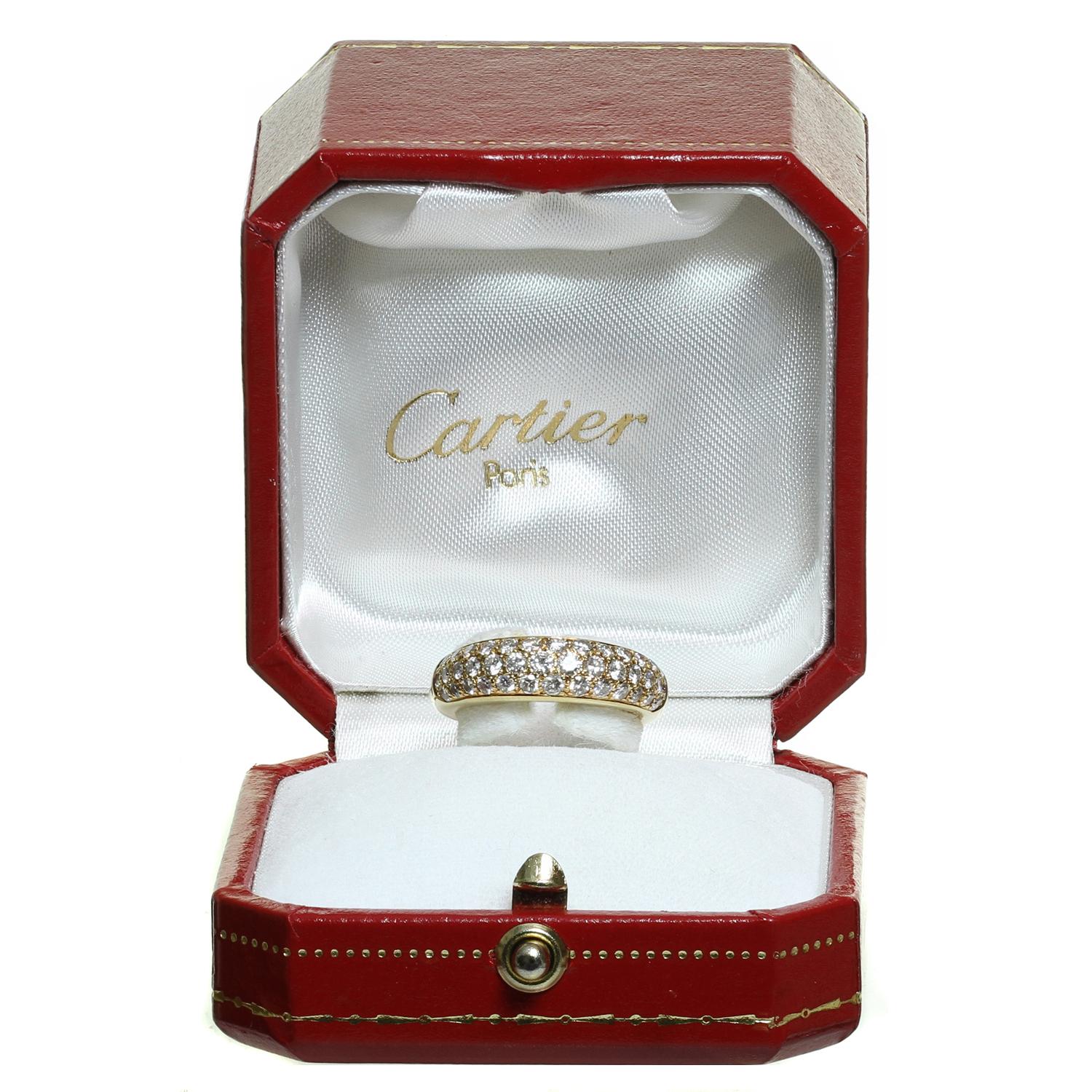 This classic Cartier ring is crafted in 18k yellow gold and pave-set with brilliant-cut round D-F VVS1-VVS2 diamonds weighing an estimated 1.10 carats. Made in France circa 1993. Measurements: 0.23