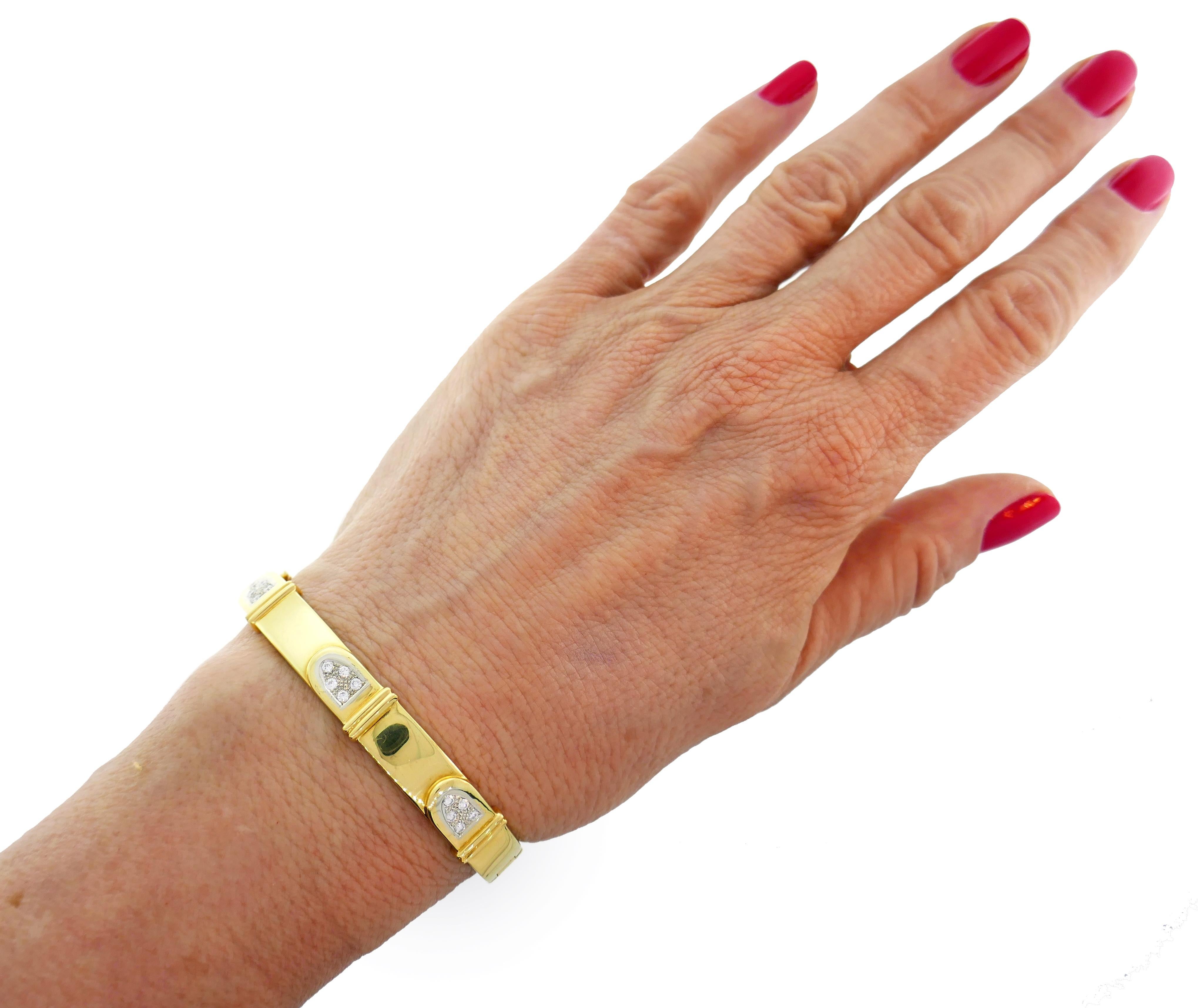 Stylized buckle bracelet created by Cartier in Italy in the 1980s. Elegant and wearable, the bangle is a great addition to your jewelry collection. 
Made of 18 karat (stamped) yellow gold and accented with round brilliant cut diamonds (F-G color,