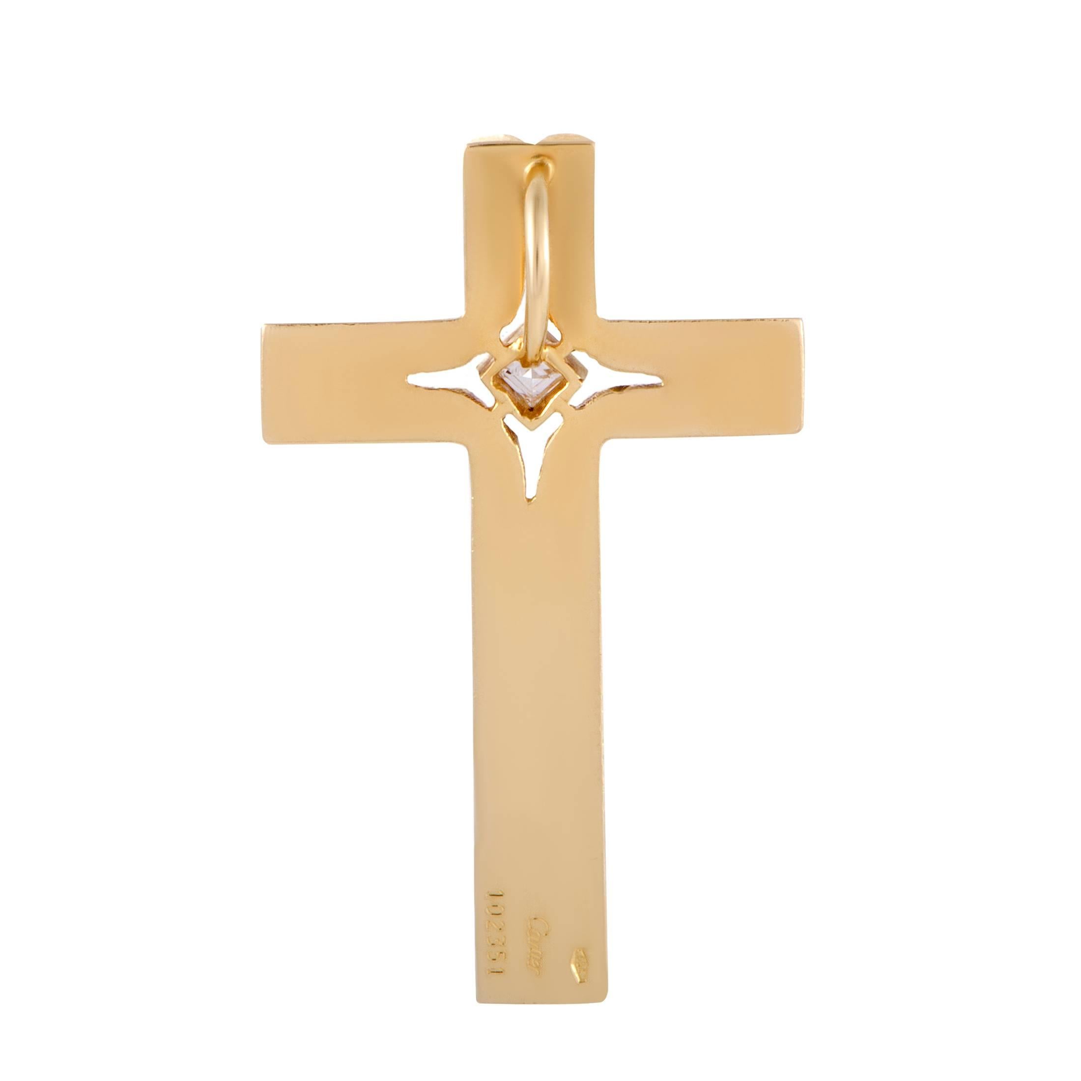 Presented in classy 18K yellow gold and designed in an incredibly sophisticated manner, this sublime cross pendant from Cartier is an epitome of elegance. The pendant is set with a colorless (grade F) diamond of VVS clarity that weighs 0.15