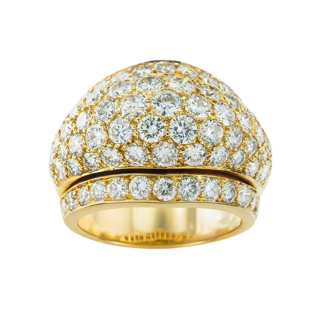 Cartier diamond and yellow gold Nigeria bombé ring circa 1990. *

SPECIFICATIONS:

DIAMONDS:  eighty-seven round brilliant-cut diamonds totaling approximately 5.00 carats, approximately F-G color, VS clarity.

METAL:  18-karat yellow gold.

WEIGHT: 