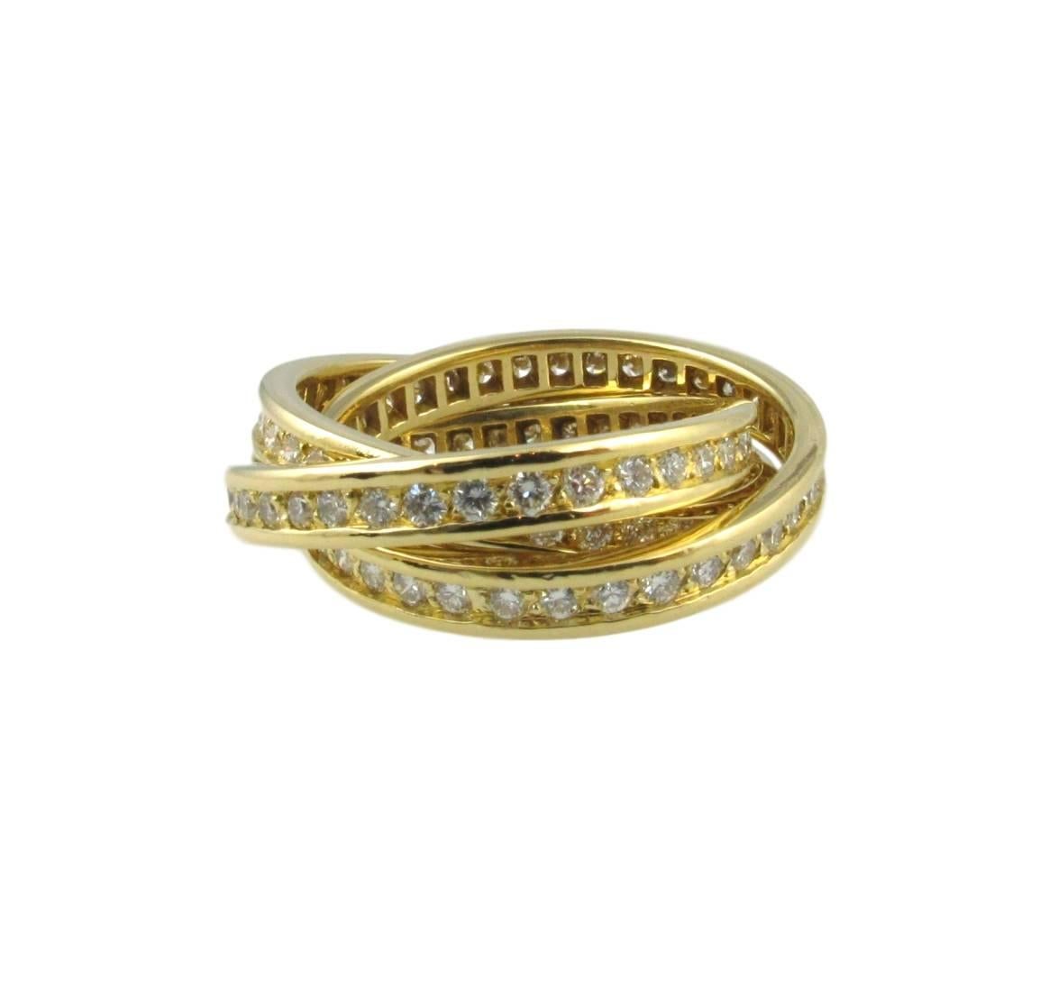 3 yellow intertwined diamond bands set with a total of 96 brilliant-cut diamonds totaling 1.55 carats.
French assay marks.
Signed Cartier
'Conceived by Louis Cartier in 1924, the Trinity ring is one of the Maison’s signature pieces of jewellery. The