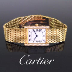 Cartier Diamonds Yellow Gold Grain de Riz Tank Wristwatch, circa 1970