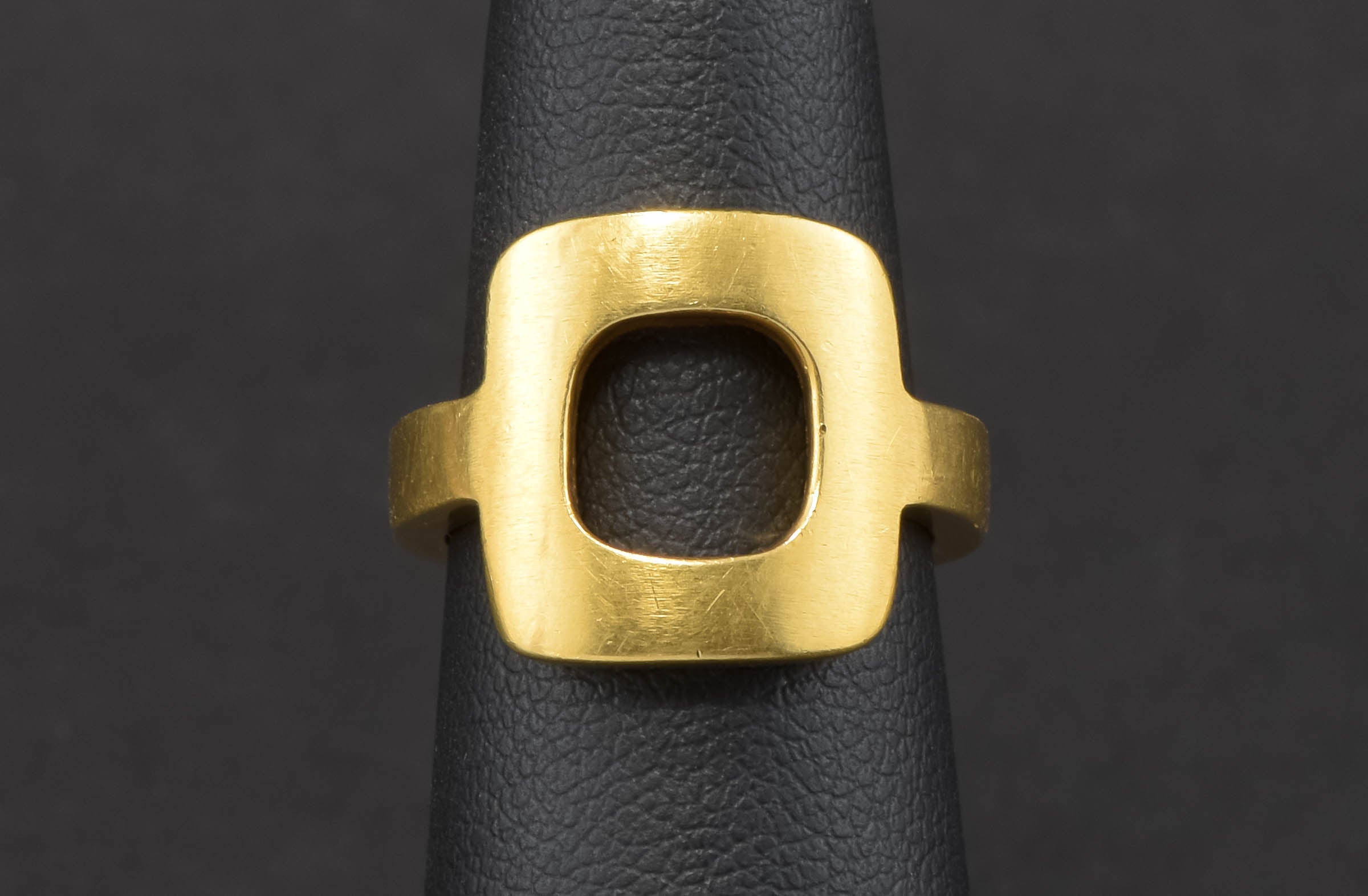 A truly fabulous authentic Jean Dinh Van for Cartier ring dating to the 1960s....hallmarked for both the French jewelry designer and Cartier....

Crafted of beautiful, buttery 18K yellow gold, the ring features a strong, simple modernist design with